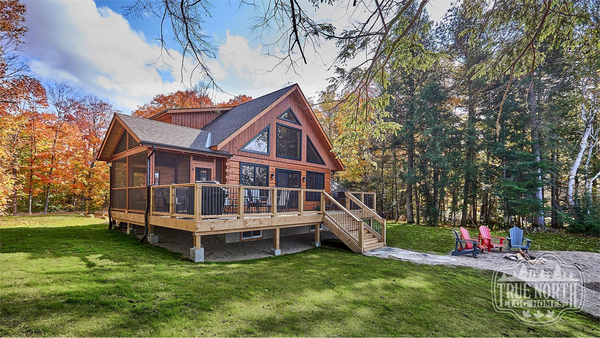 Arrowhead two-storey Canadian log home with cathedral ceilings and floor-to-ceiling windows - Wide Shot of Front