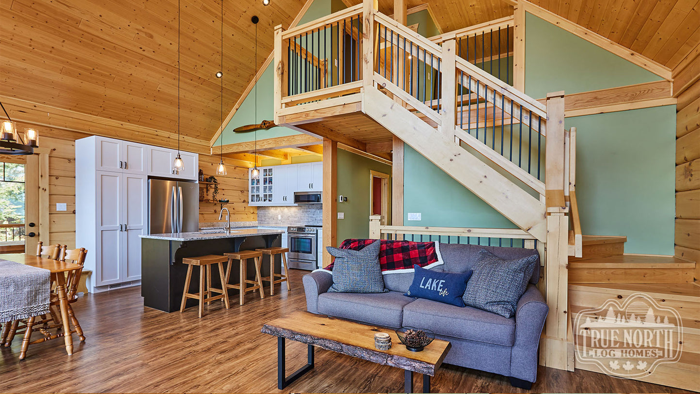 Arrowhead two-storey Canadian log home with cathedral ceilings and floor-to-ceiling windows - Interior kitchen and stairs