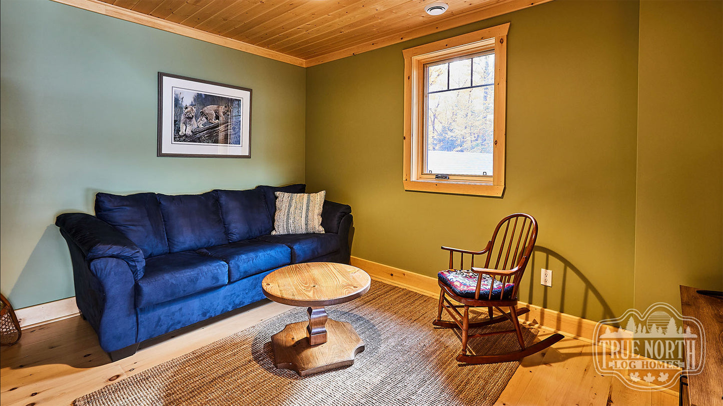 Arrowhead two-storey Canadian log home with cathedral ceilings and floor-to-ceiling windows - Lounge