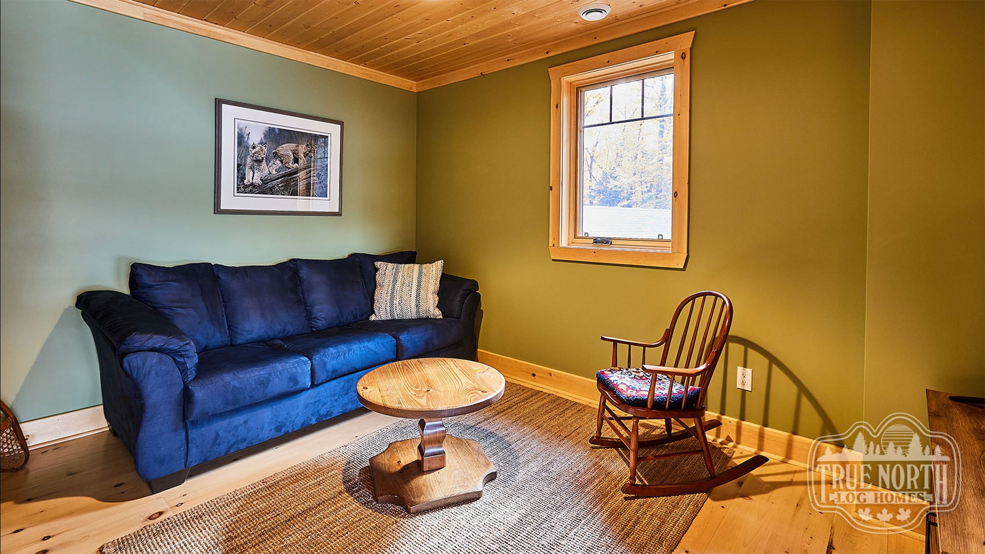 Arrowhead two-storey Canadian log home with cathedral ceilings and floor-to-ceiling windows - Lounge