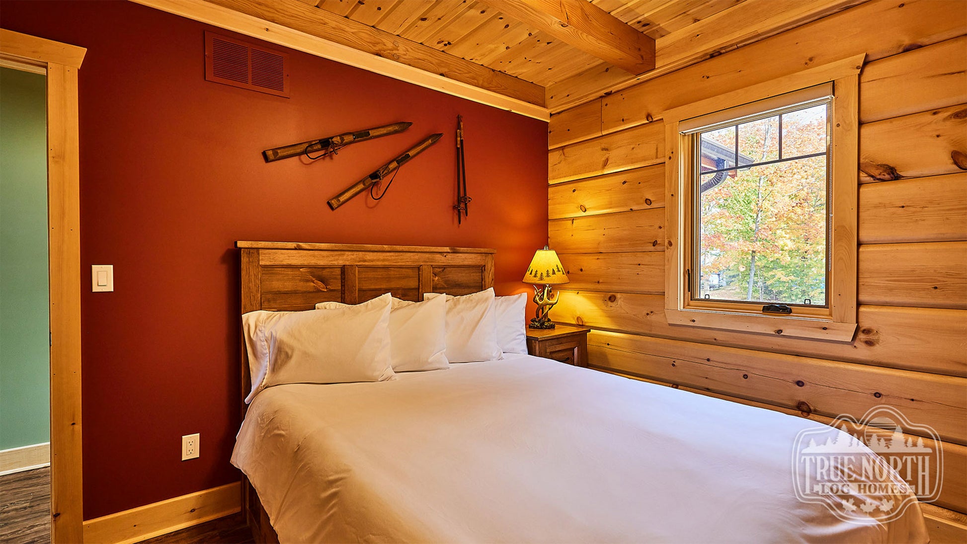 Arrowhead two-storey Canadian log home with cathedral ceilings and floor-to-ceiling windows - Double Bedroom