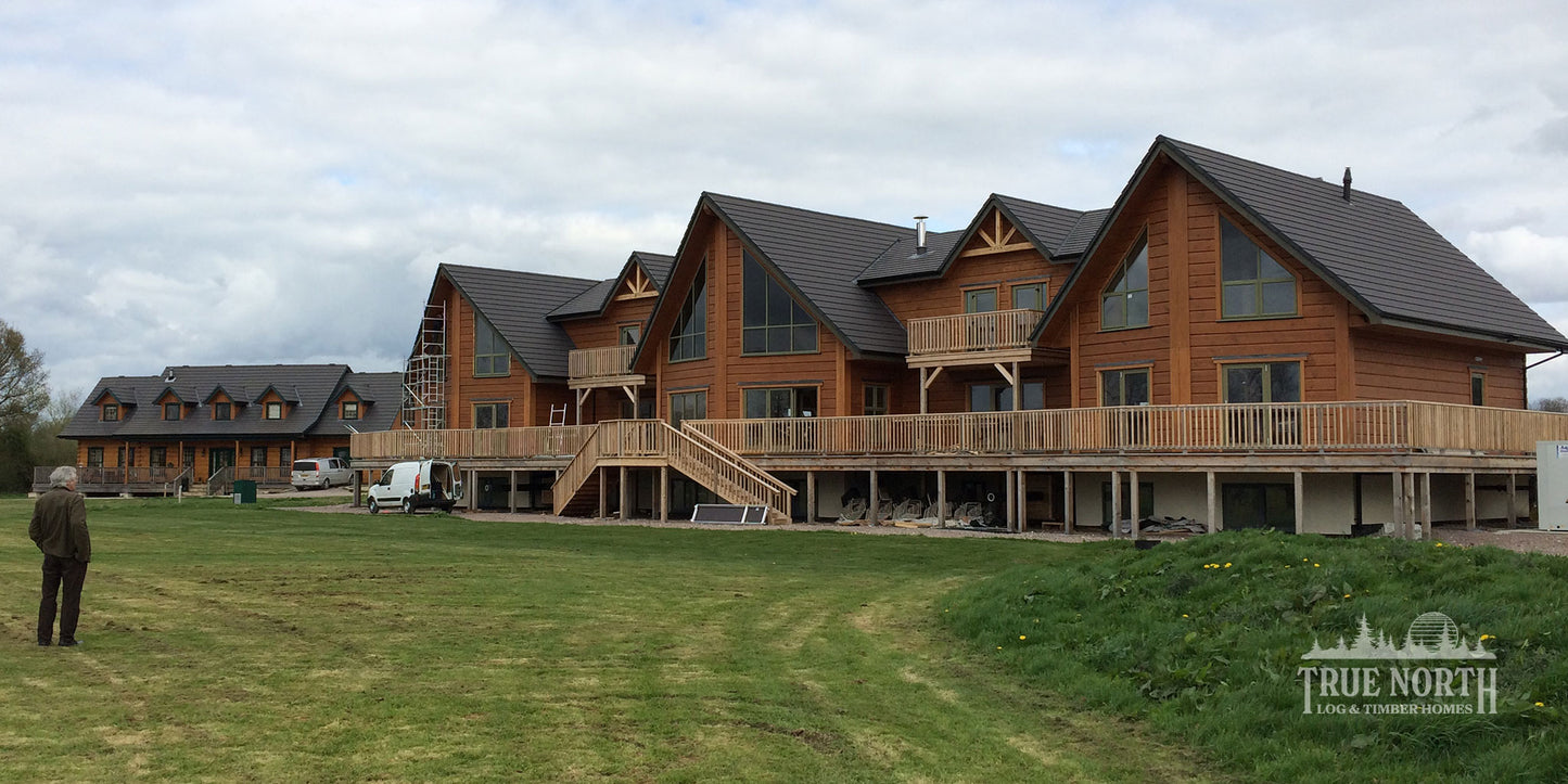 Alaskan commercial Canadian log building built for Foundation Matters charity - Alaskan and Louisburg side by side