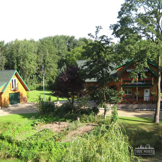 Norfolk luxury Canadian log home by True North Log Homes, set within a woodland setting in Norfolk – home and detached garage with studio.