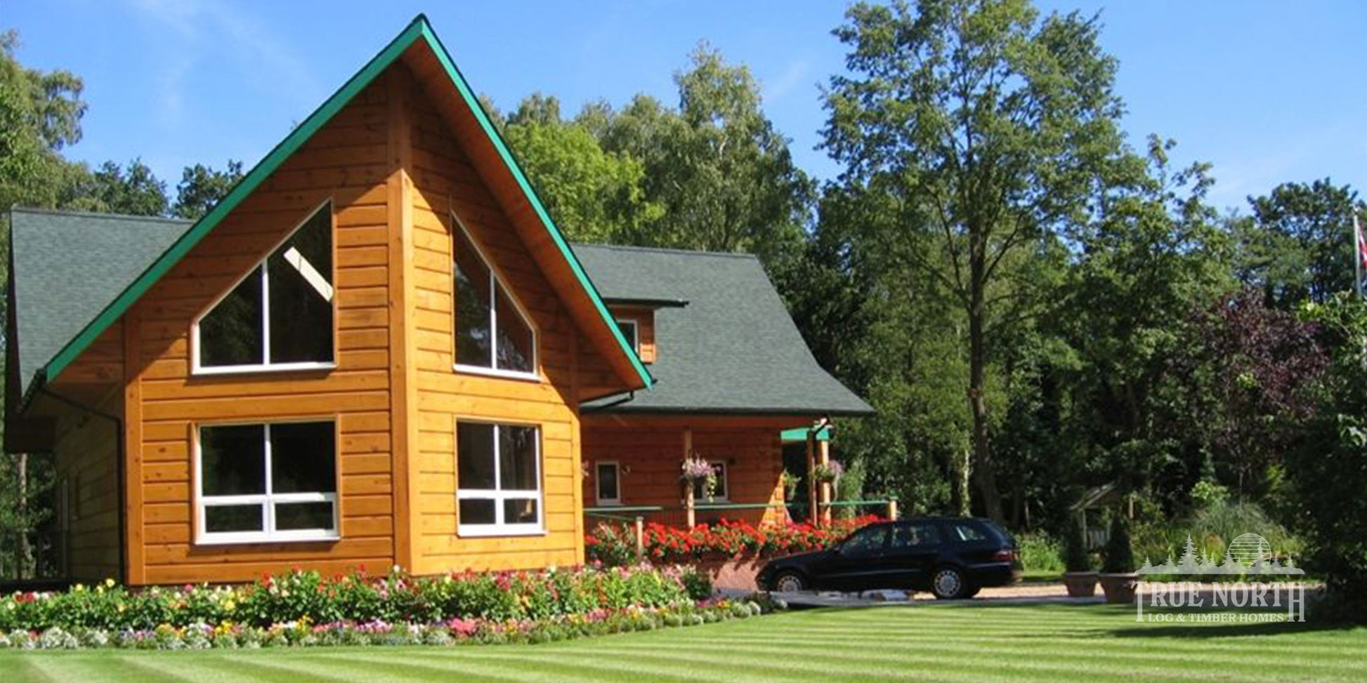 Norfolk luxury Canadian log home set within a woodland setting in Norfolk - Front View